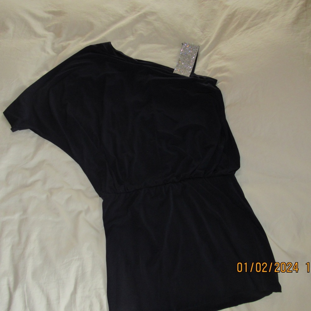 Off the one shoulder skort. Very cute